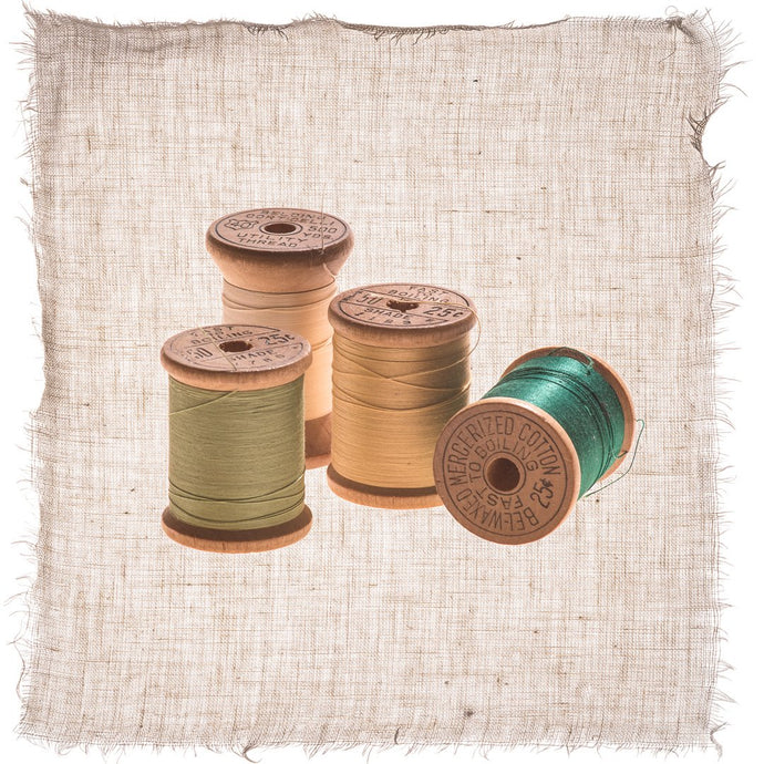 Spools of Thread on Linen